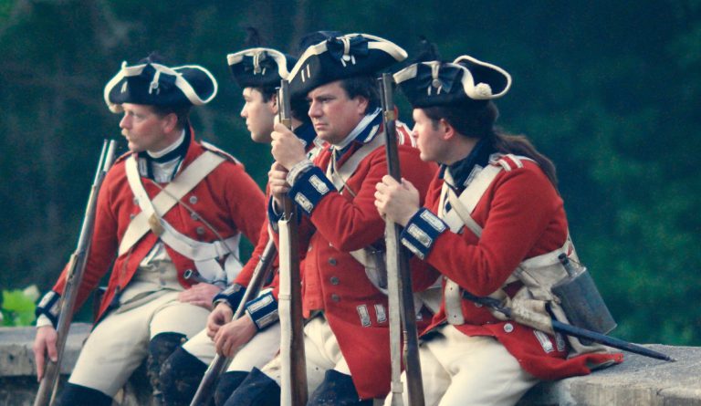 Four colonial British soldiers with muskets