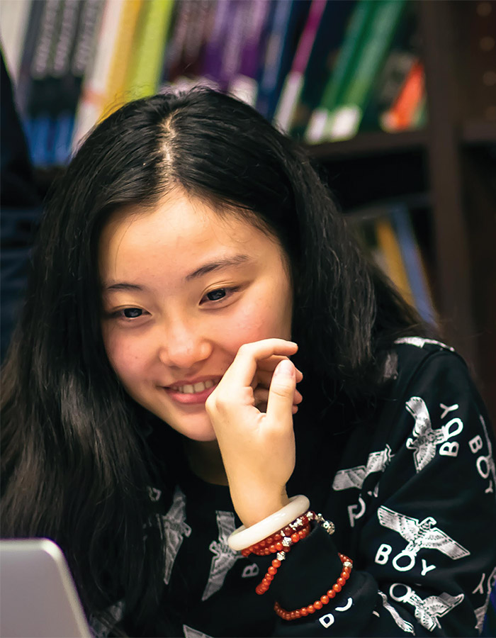 Student looking at laptop